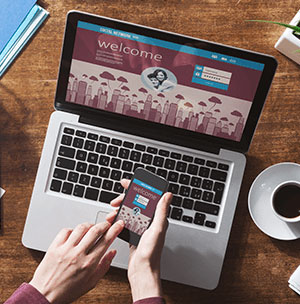 person-on-website-on-phone-and-laptop person-on-website-on-phone-and-laptop